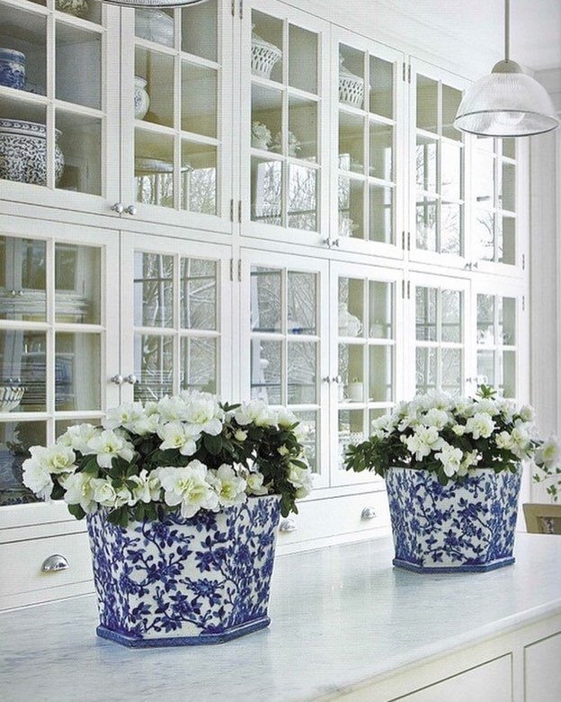 gorgeous white built ins holding dishes and china white kitchen 
