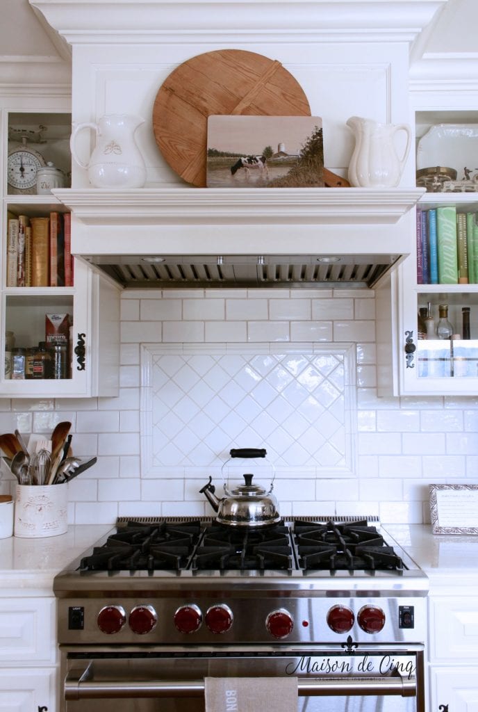 Adding Art in the Kitchen for Charm and Character! art in the kitchen stove mantel artwork bread boards ironstone pitchers subway tile backsplash