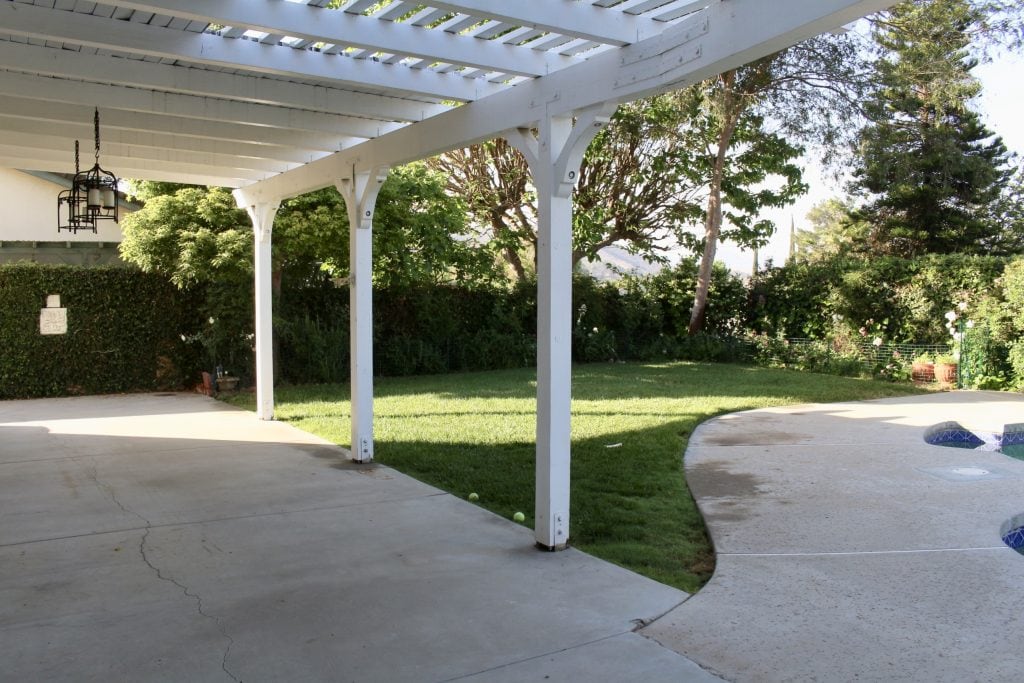 backyard renovation cracked concrete landscape grass before photo