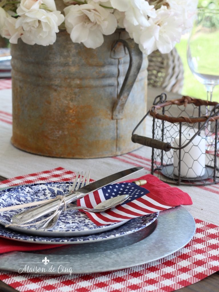 patriotic table setting american flag with red napkin on blue floral plate