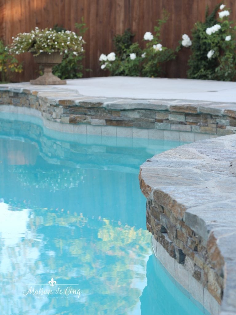 pool coping and water line tile flagstone