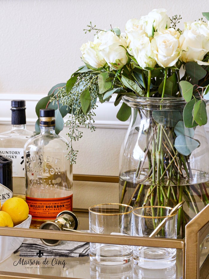  bar cart styling with roses and gold rimmed glasses