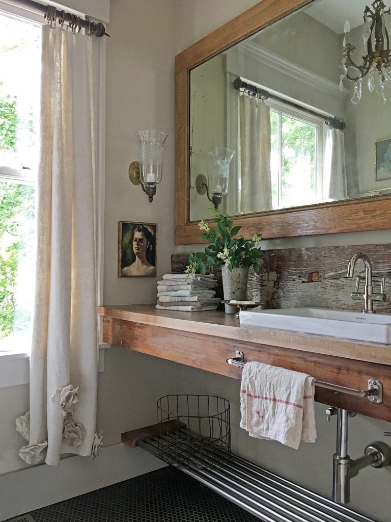 vintage style bathroom with wood sink crystal chandelier 