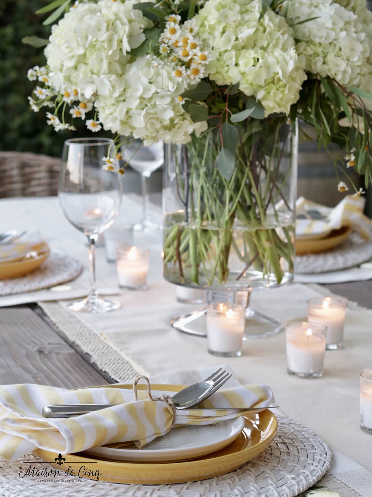 beautiful outdoor table setting with flowers and candles elevate your outdoor space 