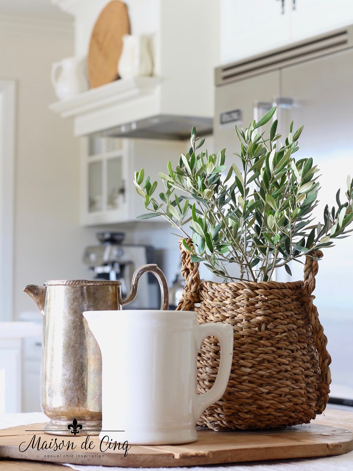 how to decorate with odd numbers vignette with olive plant, silver pitcher and vintage ironstone pitcher 