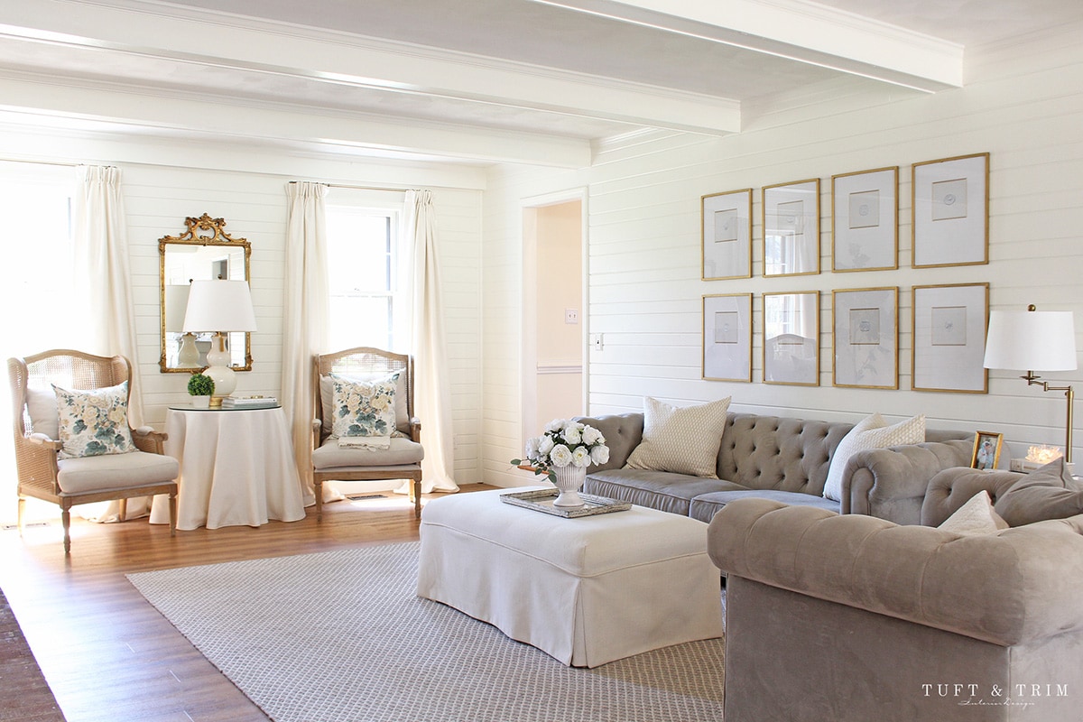 gorgeous French inspired family room with grey sofas and neutral decor 