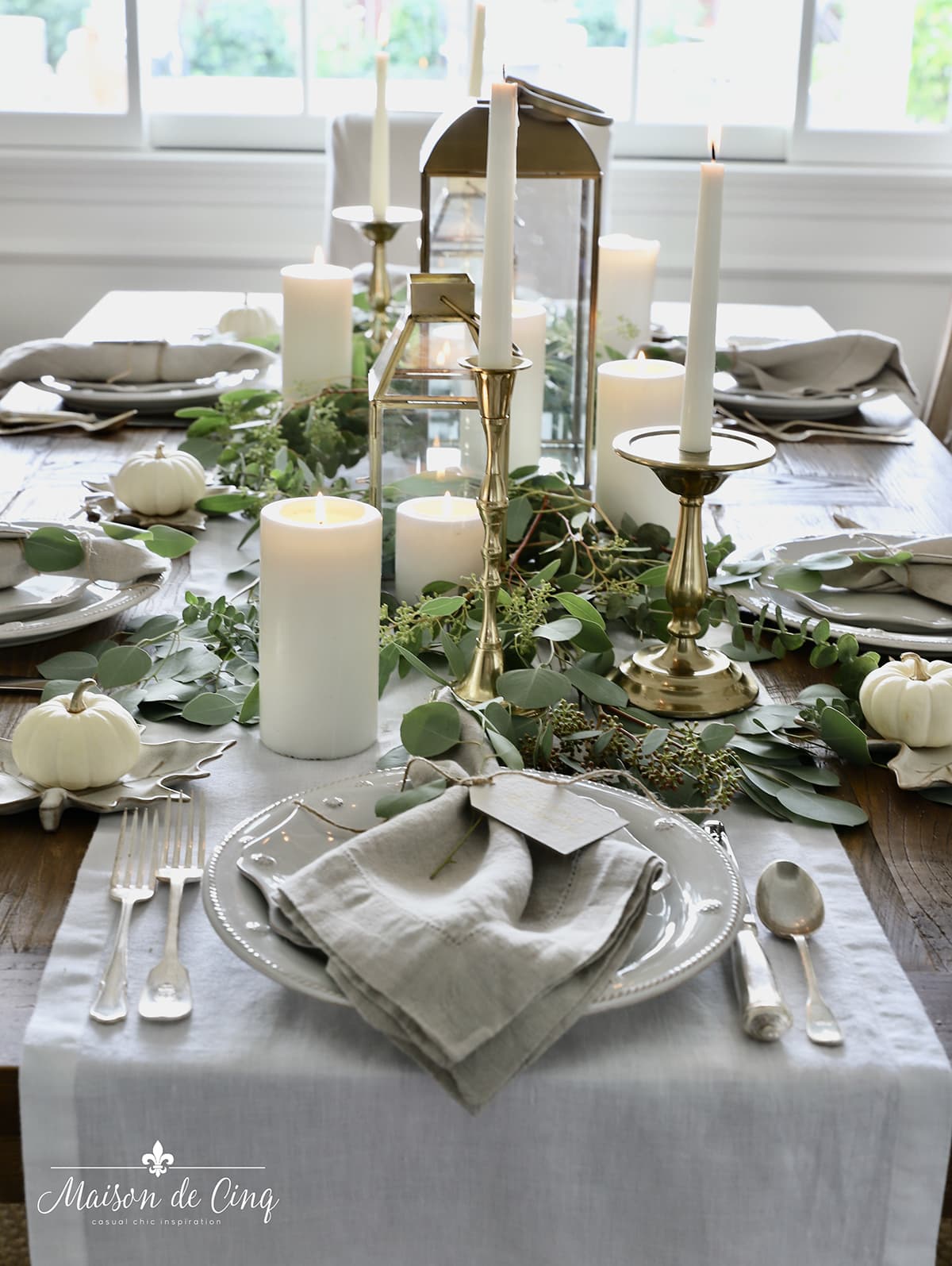 Gold Plates & Utensils on a Simple White Linen Table