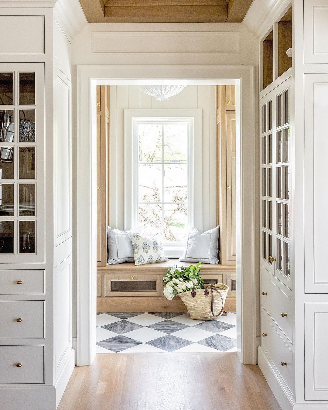 beautiful mudroom with checkerboard floors French farmhouse style
