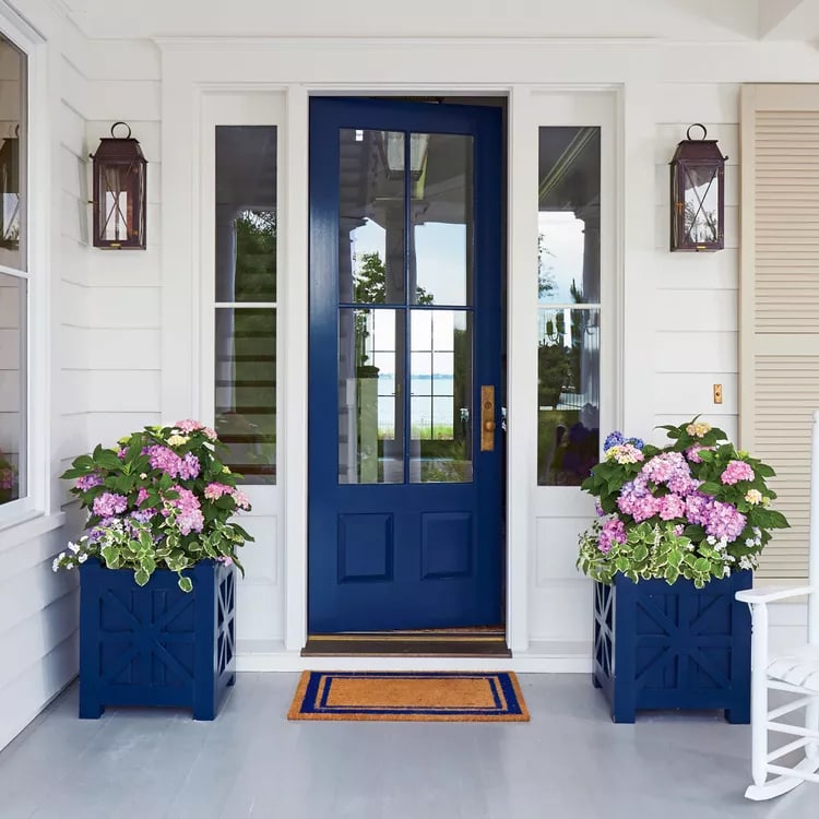 deep blue door with matching blue planters gorgeous spring porch decor 