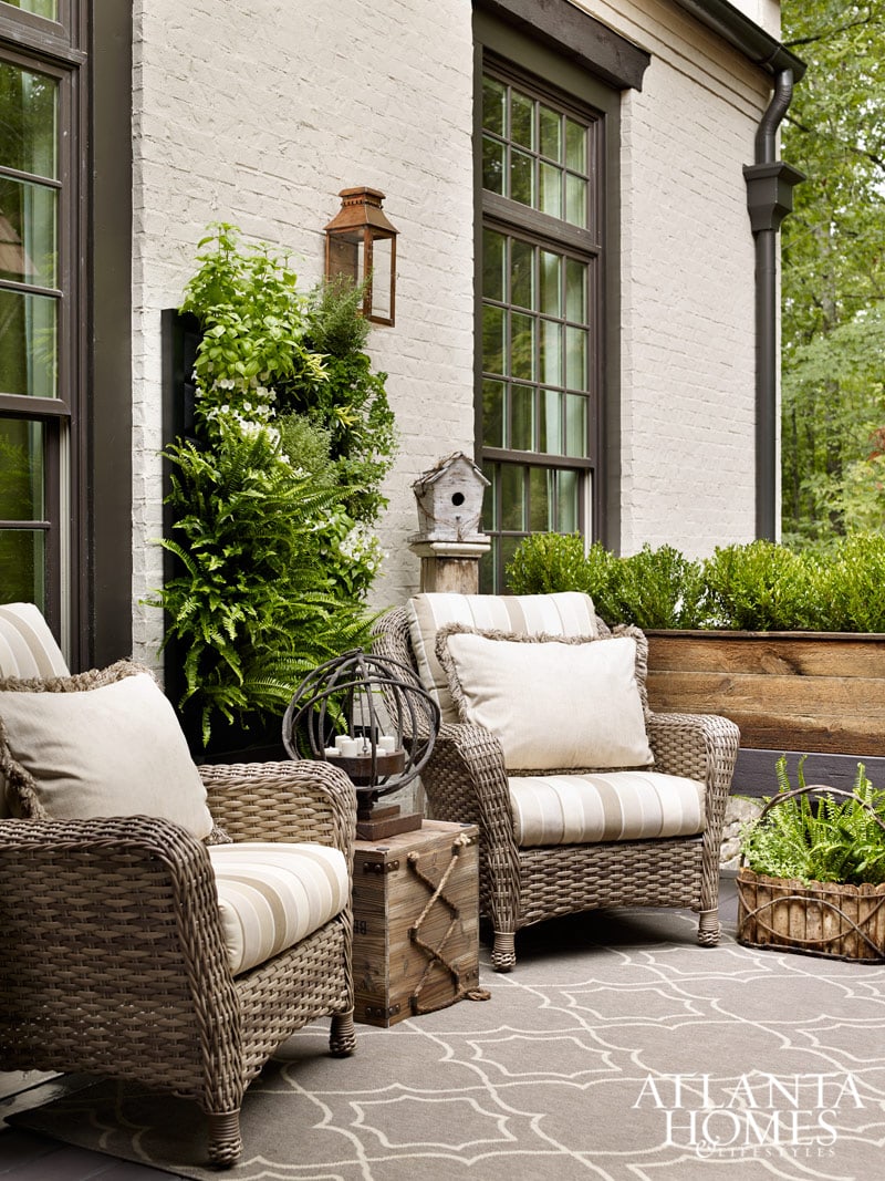 cozy patio seating area with outdoor rug and wicker chairs 