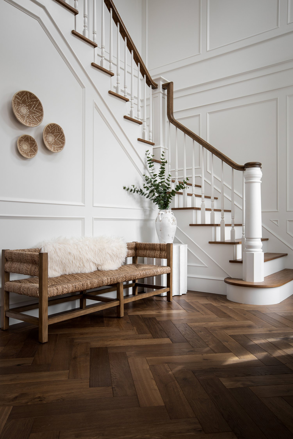 home design trends for 2024 herringbone wood floors in French inspired entryway 