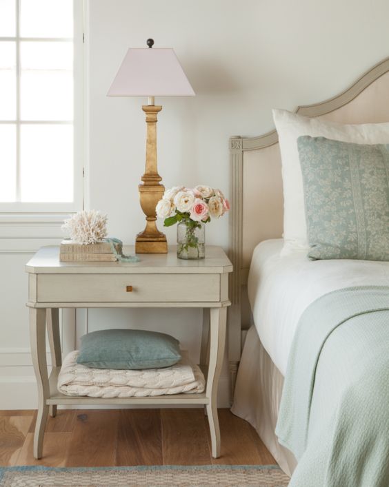 gorgeous French inspired bedroom nightstand with gold lamp and green bedding
