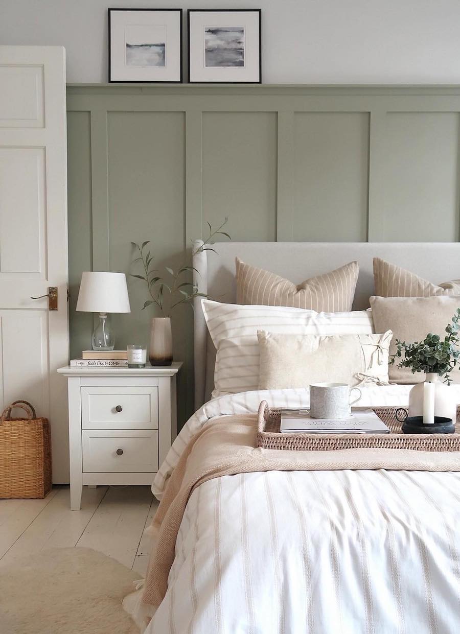 beautiful bedroom with sage walls wainscoting 