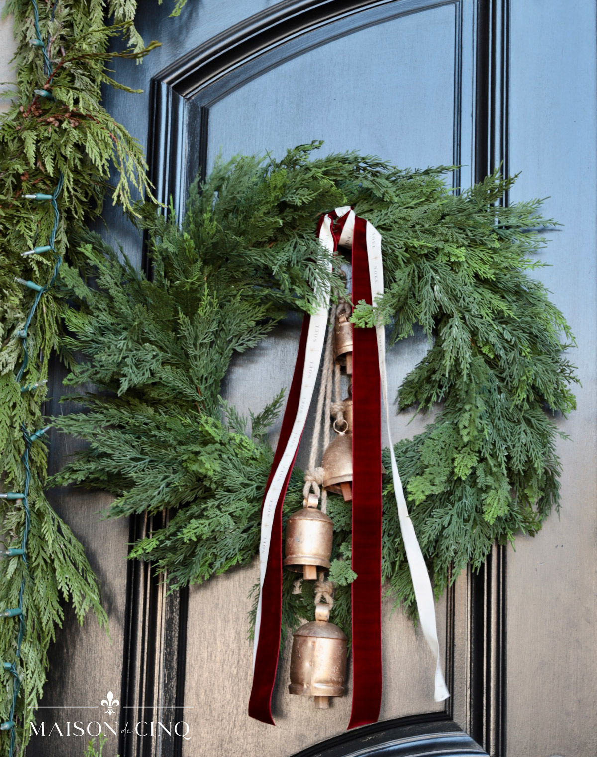 gorgeous cedar wreaths with burgundy ribbons and brass bells 