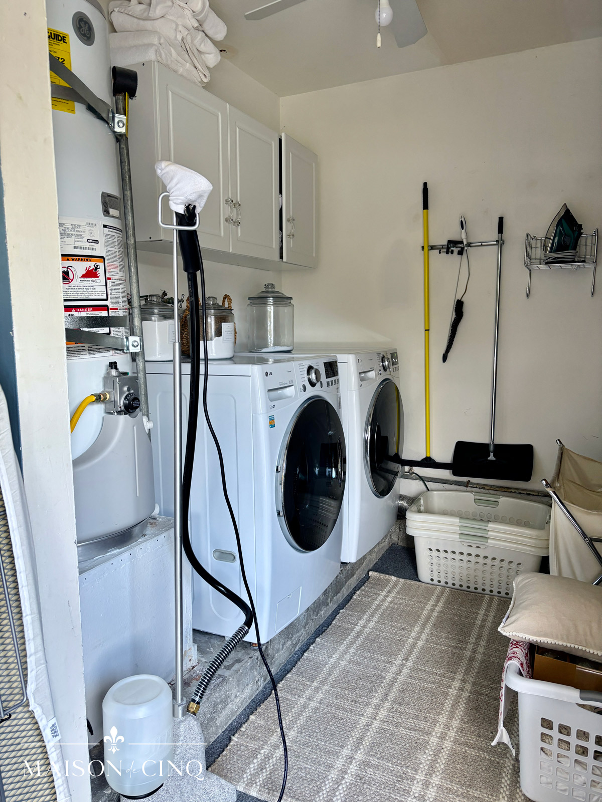 before of crowded laundry room in garage 