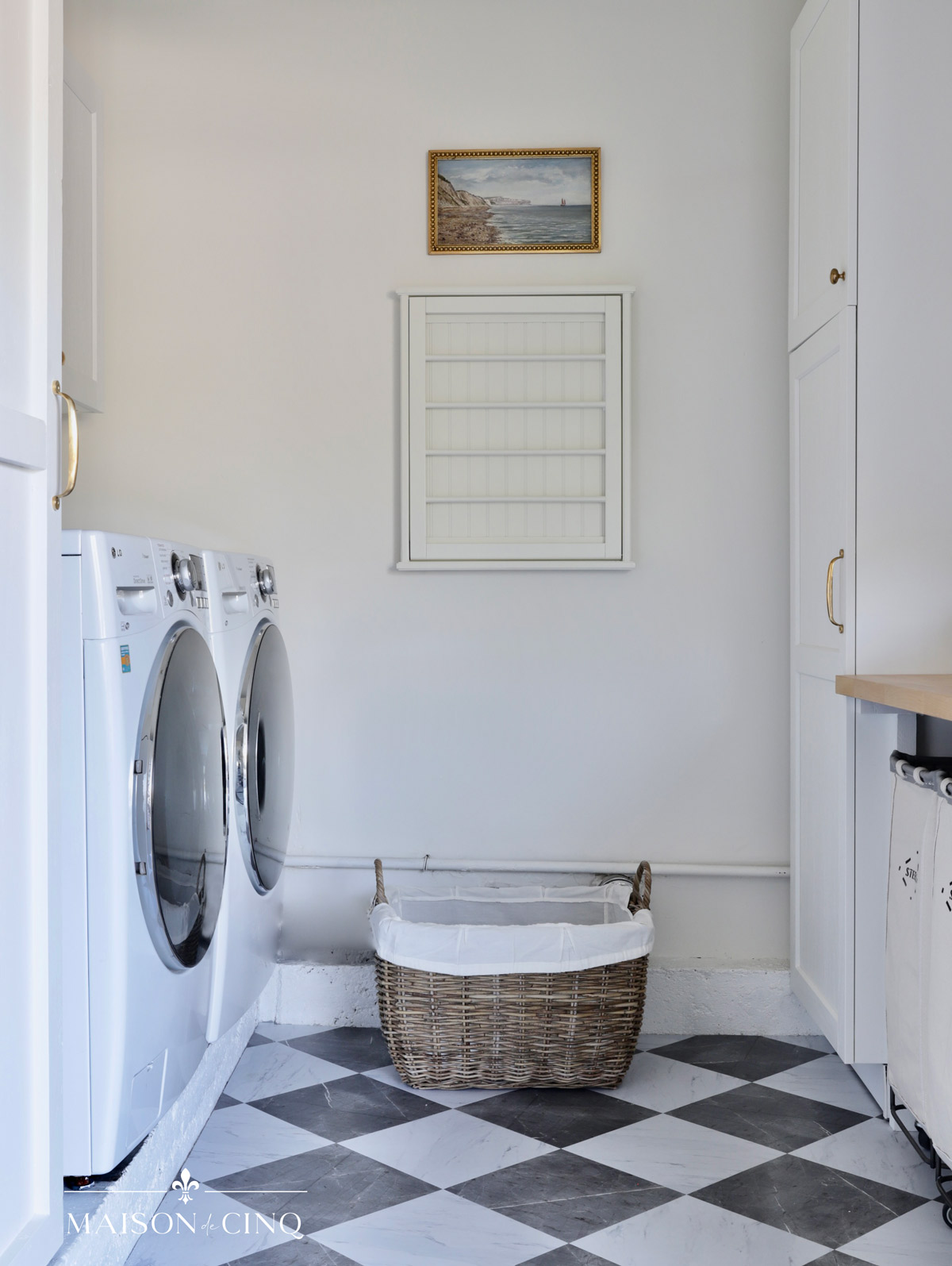 laundry room makeover with white walls, ikea shelves and checkerboard floors 