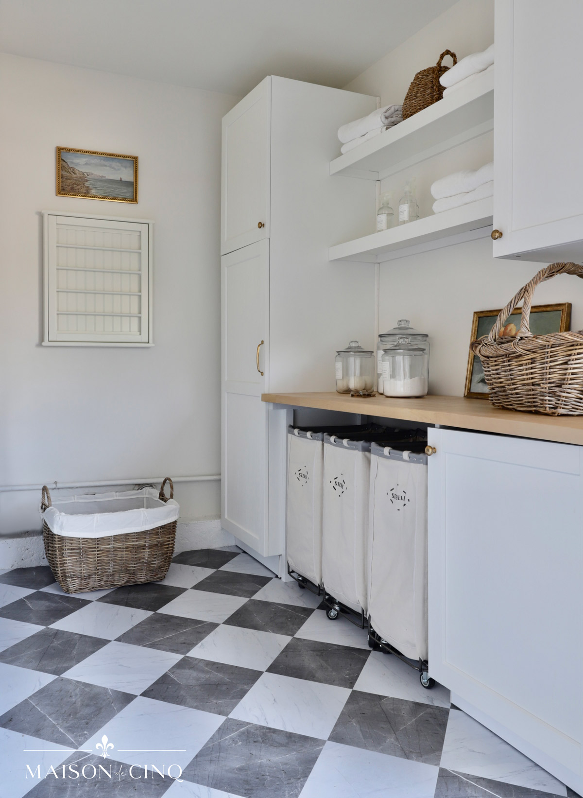 gorgeous laundry room makeover with diamond patterned floors and ikea white cabinets open shelving 
