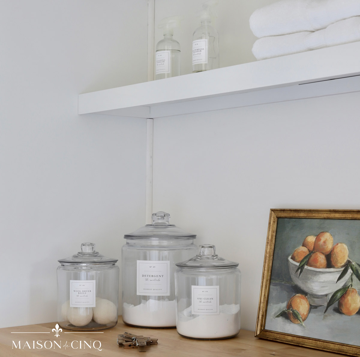 laundry canisters with detergent and other supplies on counter 