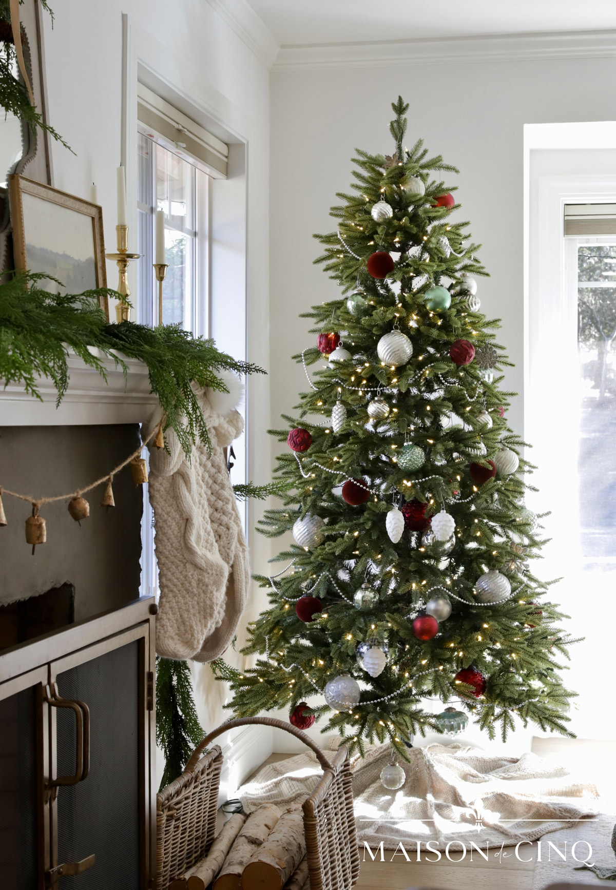 Christmas tree with burgundy sage green and silver ornaments silver garland living room Christmas decor 