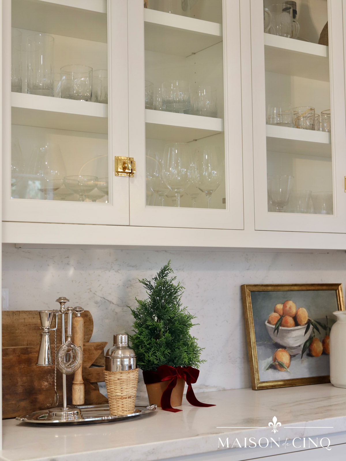 bar area decorated for Christmas with little tree burgundy ribbon