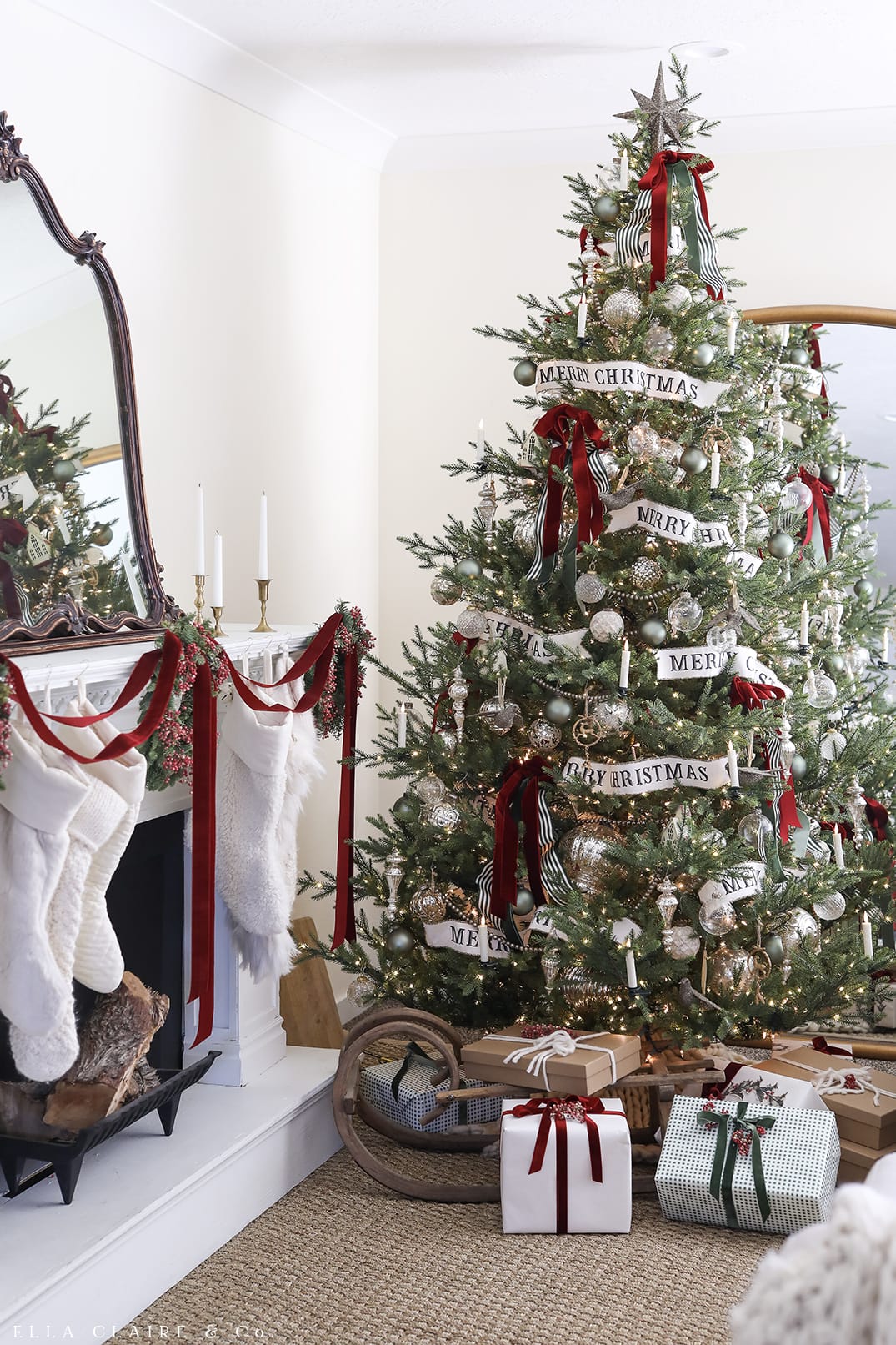 gorgeous Christmas tree with silver and white ornaments with burgundy ribbons