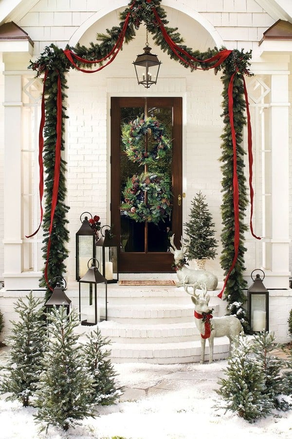 Classic Christmas Decor: 20 Stunning Ideas to Inspire stunning porch with traditional Christmas decor garland and wreaths and trees