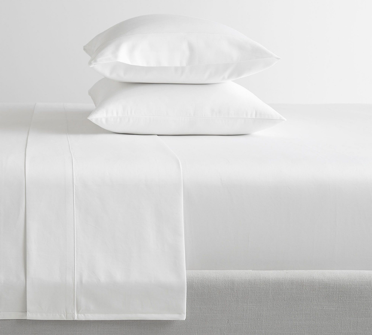 elevating your bedroom with quality sheets and pillows 